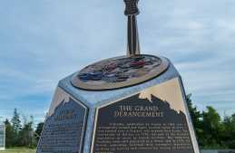 Visit the
Acadian Odyssey Monument commemorating the founding of Clare, located underneath
a large Acadian flag in front of the Rendez-vous de la Baie Visitor Centre on the campus of Université Sainte-Anne.